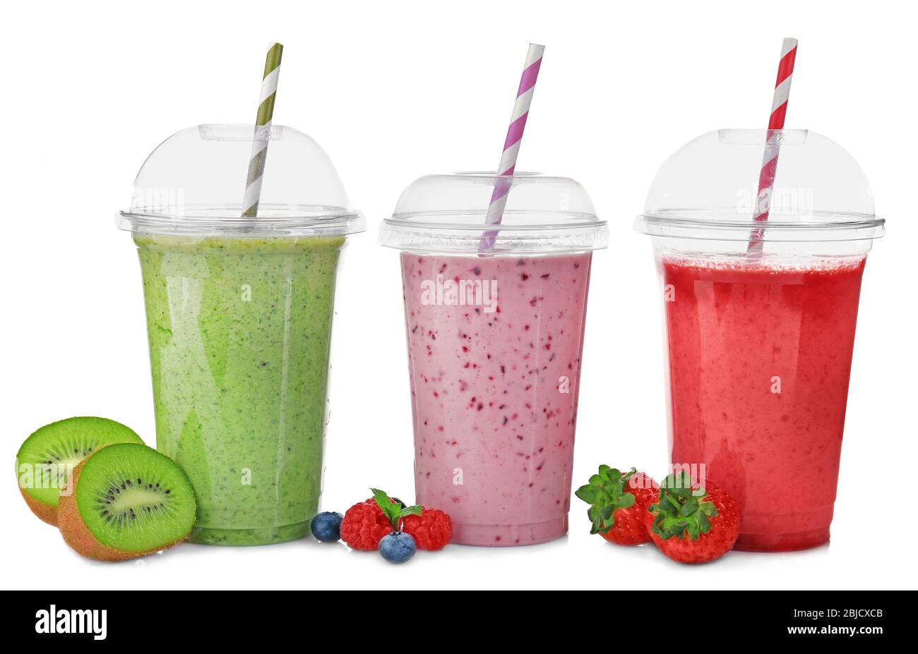 Tasty fruit cocktails in plastic cups isolated on white Stock Photo Alamy