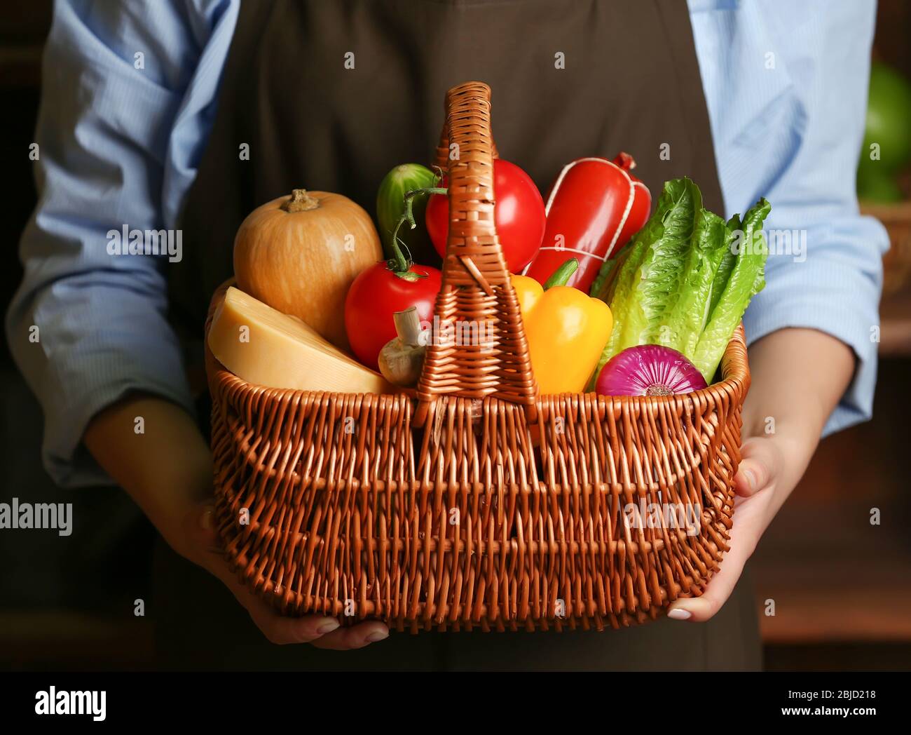 Hands holding wicker basket hi-res stock photography and images - Alamy