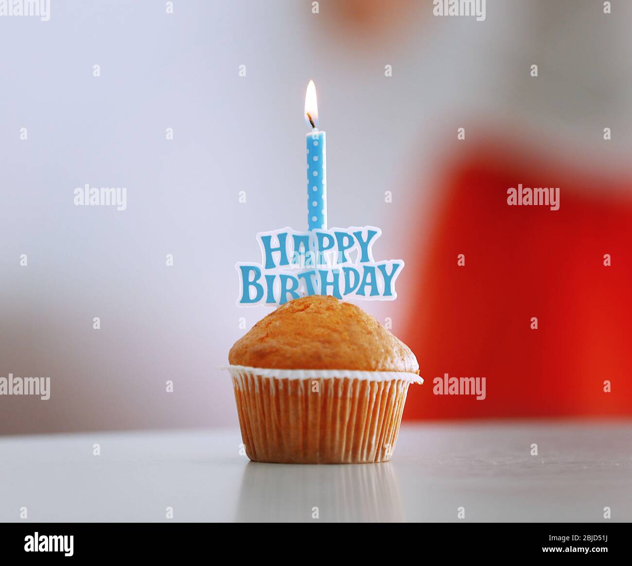 Tasty birthday cake with candle on blurred background Stock Photo - Alamy