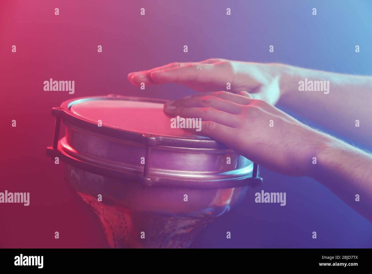 Hands of man playing African drum at concert Stock Photo