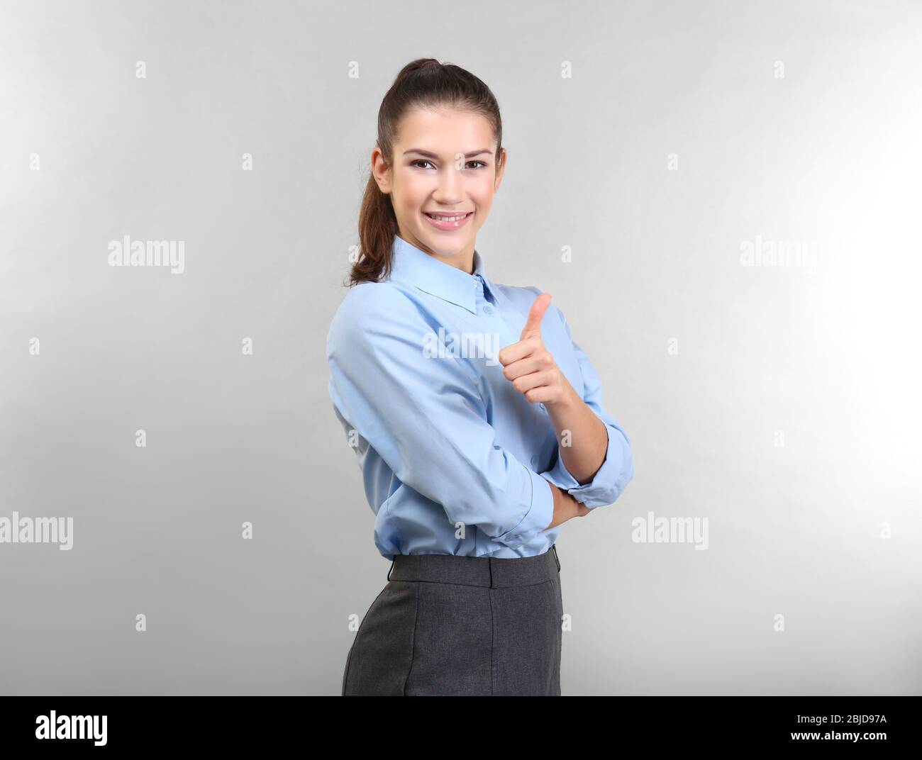 Woman showing thumb up sign hi-res stock photography and images - Alamy