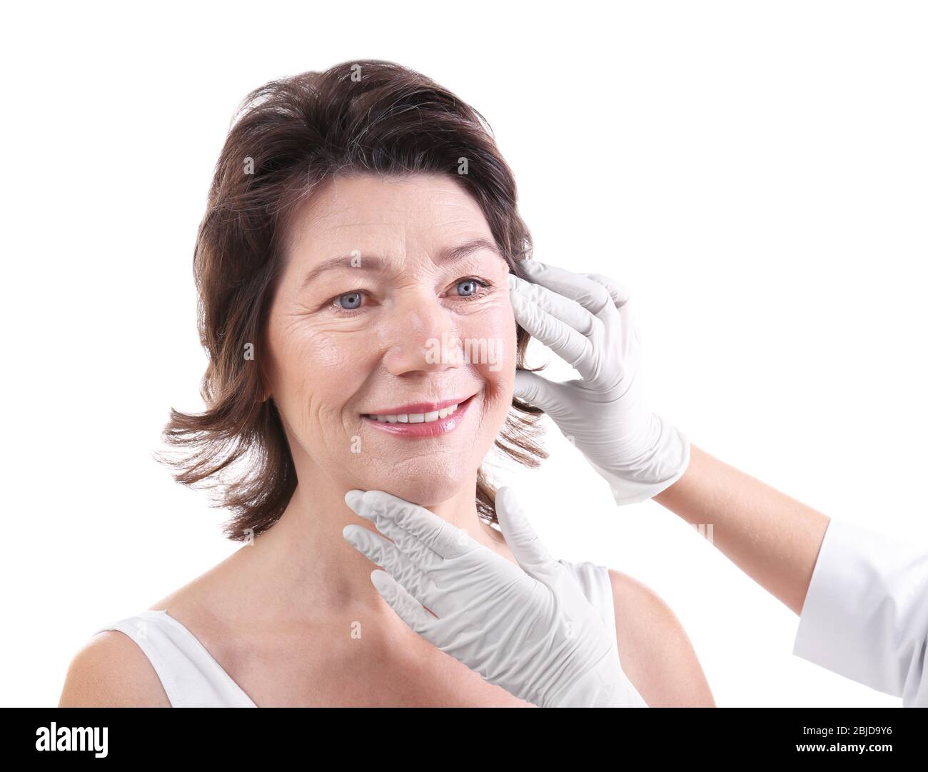 Surgeon examining female patient isolated on white Stock Photo - Alamy