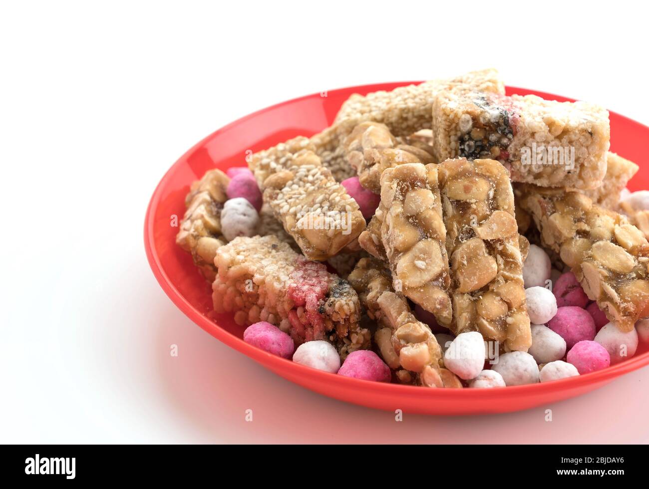 chinese traditional snack peanuts and sesame candy bars on white