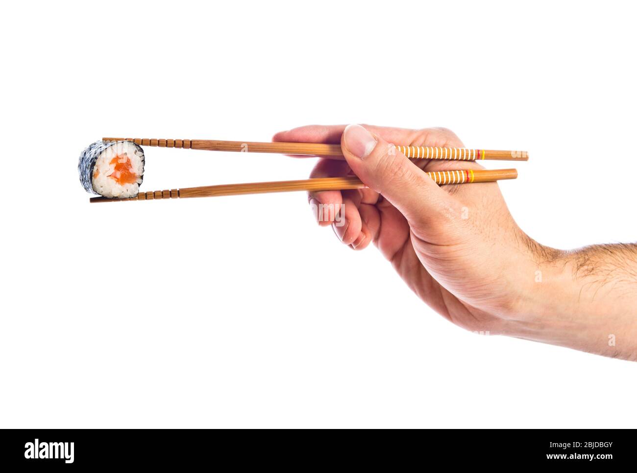hand holding sushi with chopsticks Stock Photo Alamy