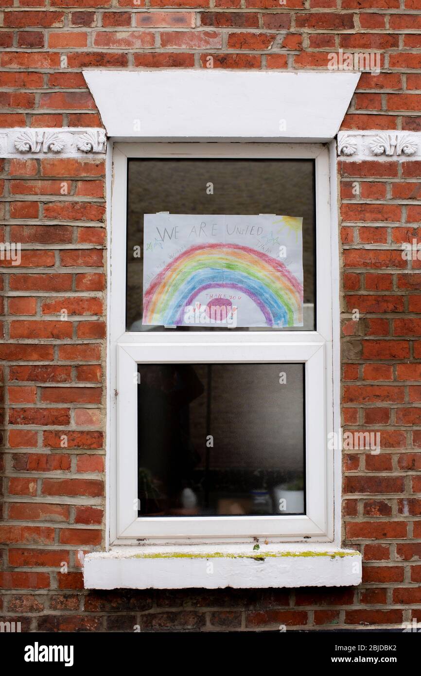 Peckham, UK. 29th April, 2020. Life In South London During The Coronavirus Lockdown. A picture of a rainbow with the words 'We Are United' in the window of a house in Peckham, South London. ( Credit: Sam Mellish/Alamy Live News ) Stock Photo