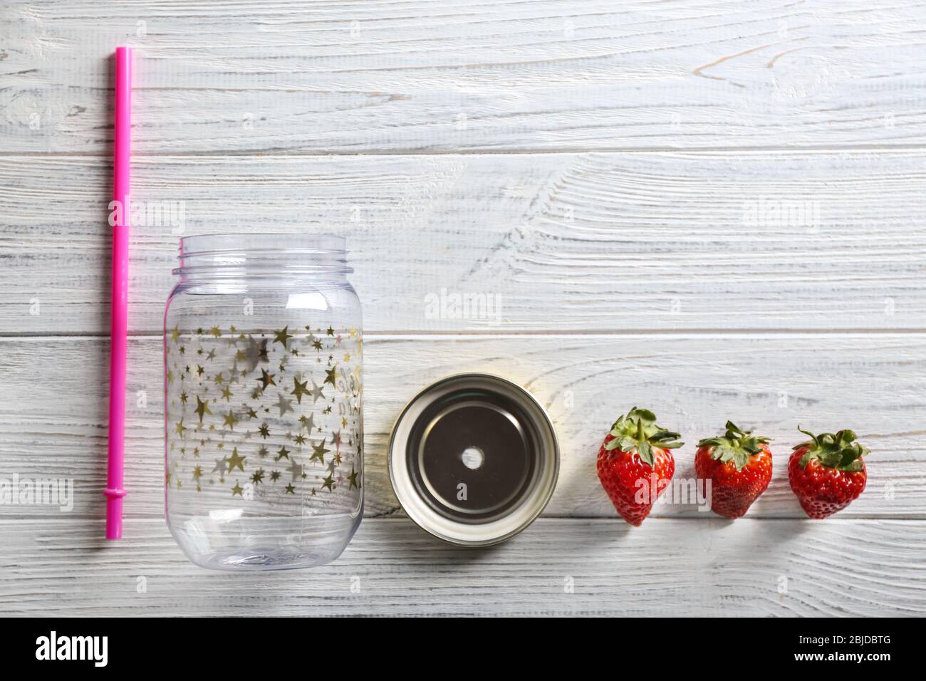 Empty mason jar with strawberries on wooden background Stock Photo - Alamy