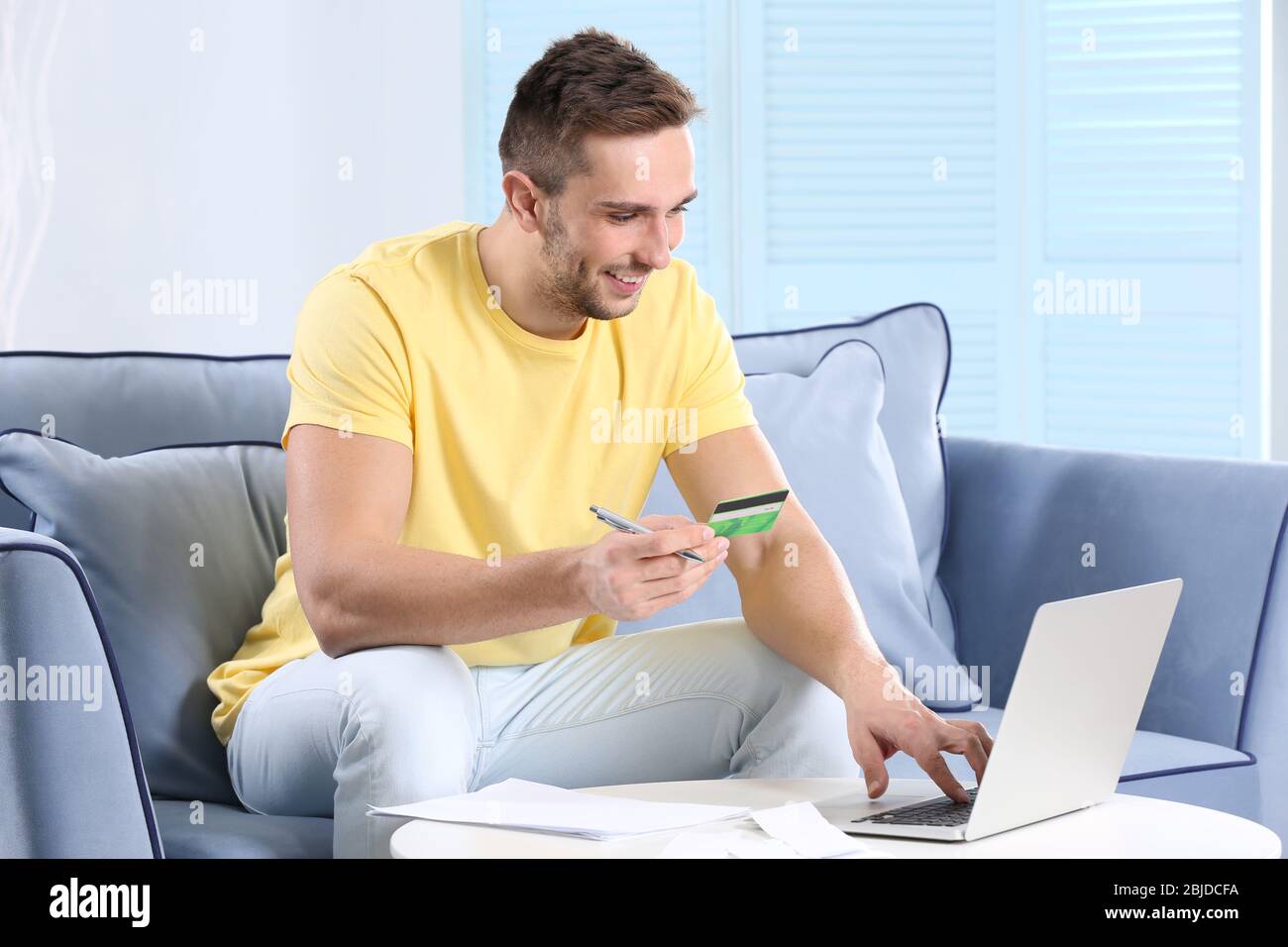 Positive young man receipt hi-res stock photography and images - Alamy