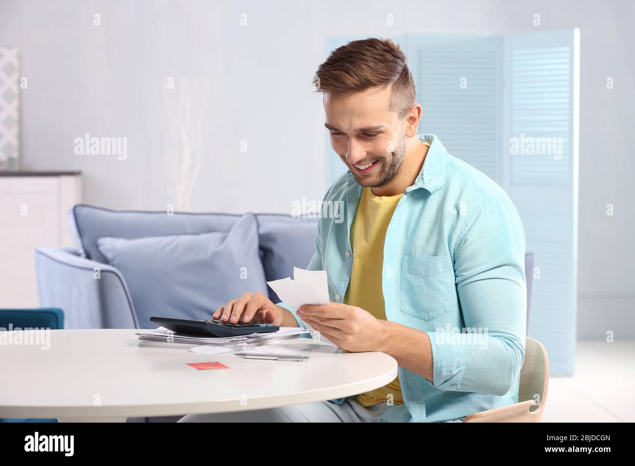 Positive young man receipt hi-res stock photography and images - Alamy
