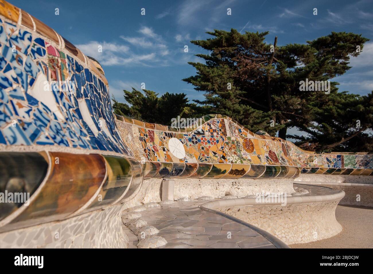 Barcelona, Spain - September 20, 2014: Large undulating seating area in the centre of Guell Park, Barcelona. The ceramic tiles that adorn the seating Stock Photo