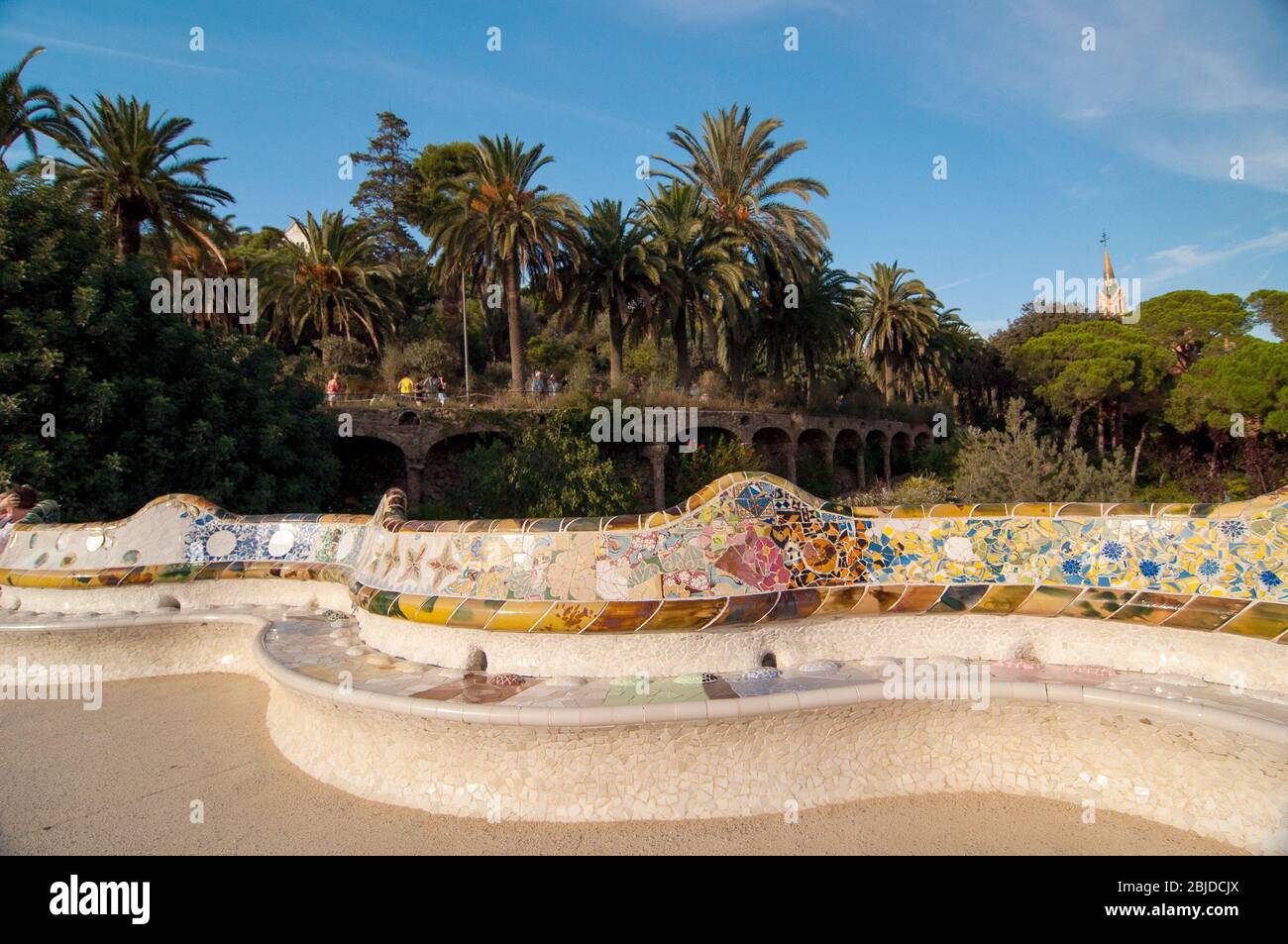 Barcelona, Spain - September 20, 2014: Large undulating seating area in the centre of Guell Park, Barcelona. The ceramic tiles that adorn the seating Stock Photo