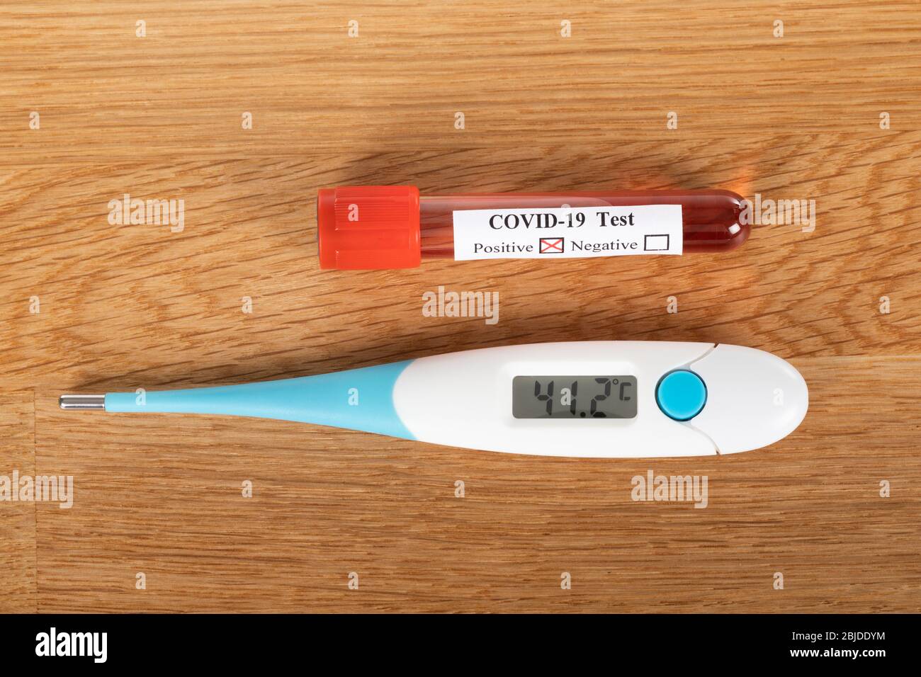 Covid-19 test blood sample and digital thermometer on wooden background  Stock Photo - Alamy