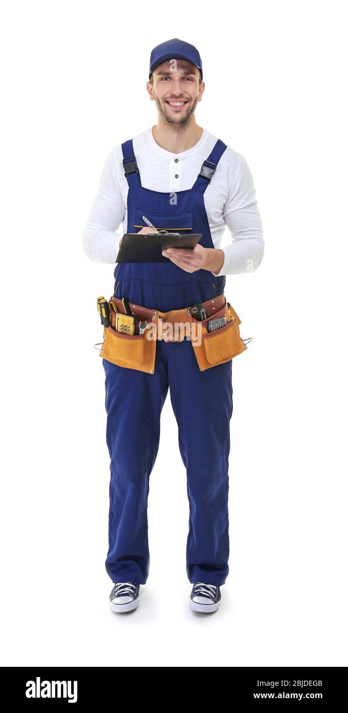 Plumber in uniform holding clipboard on white background Stock Photo