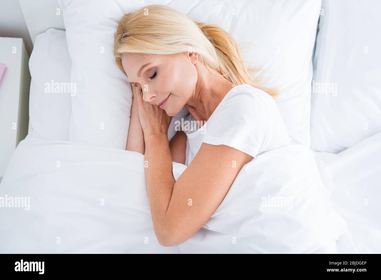 Top above high angle view close-up portrait of her she nice-looking attractive lovely pretty calm aged woman lying in bed sleeping enjoying silence Stock Photo