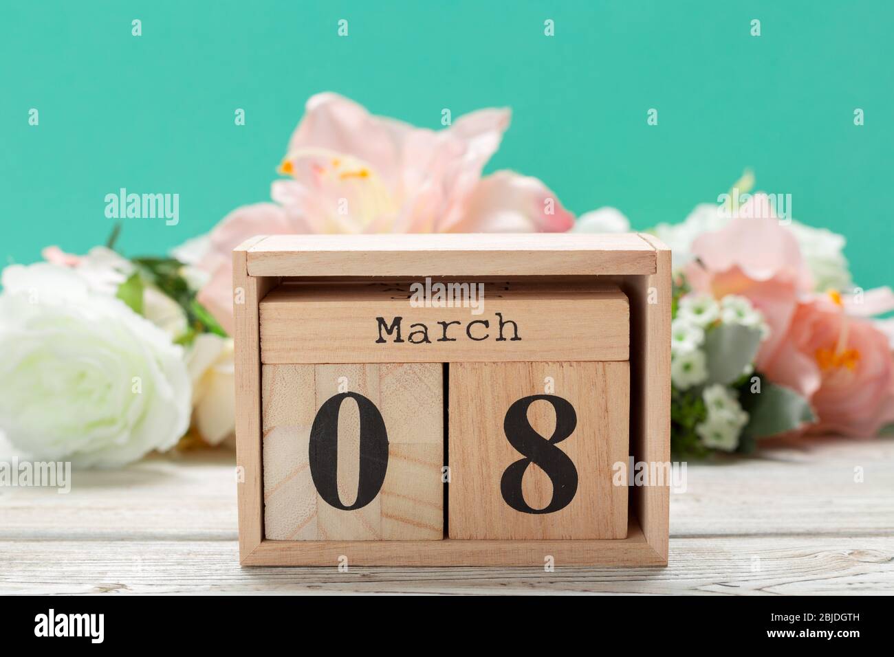 Wood blocks in box with date, day and month 8 March. Wooden blocks