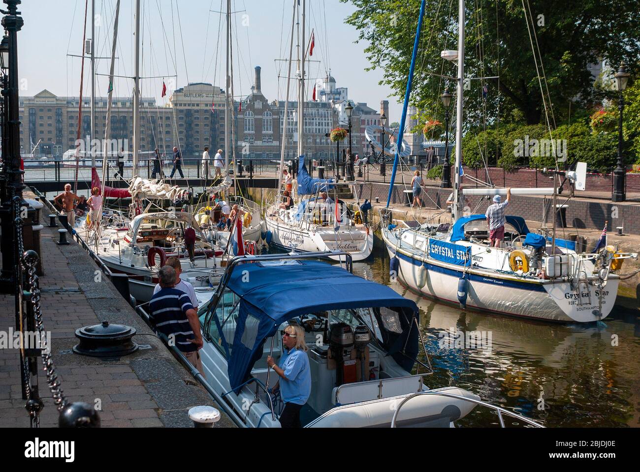 Sailing yachts going through the lock from St Katherine Docks into the