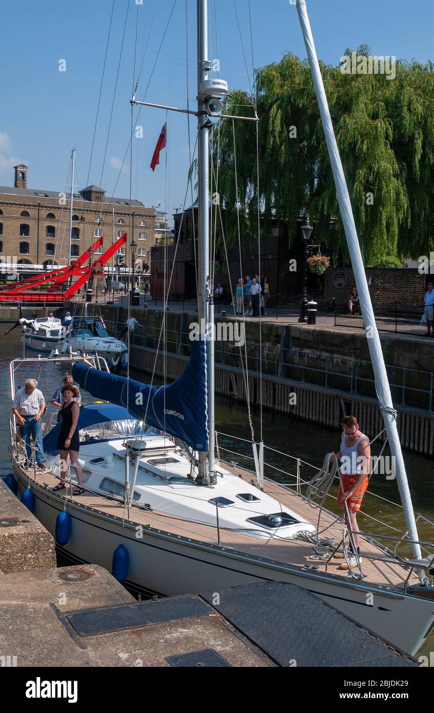 Sailing yachts going through the lock from St Katherine Docks into the