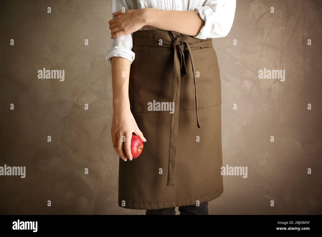 Female server wearing apron hi-res stock photography and images - Alamy