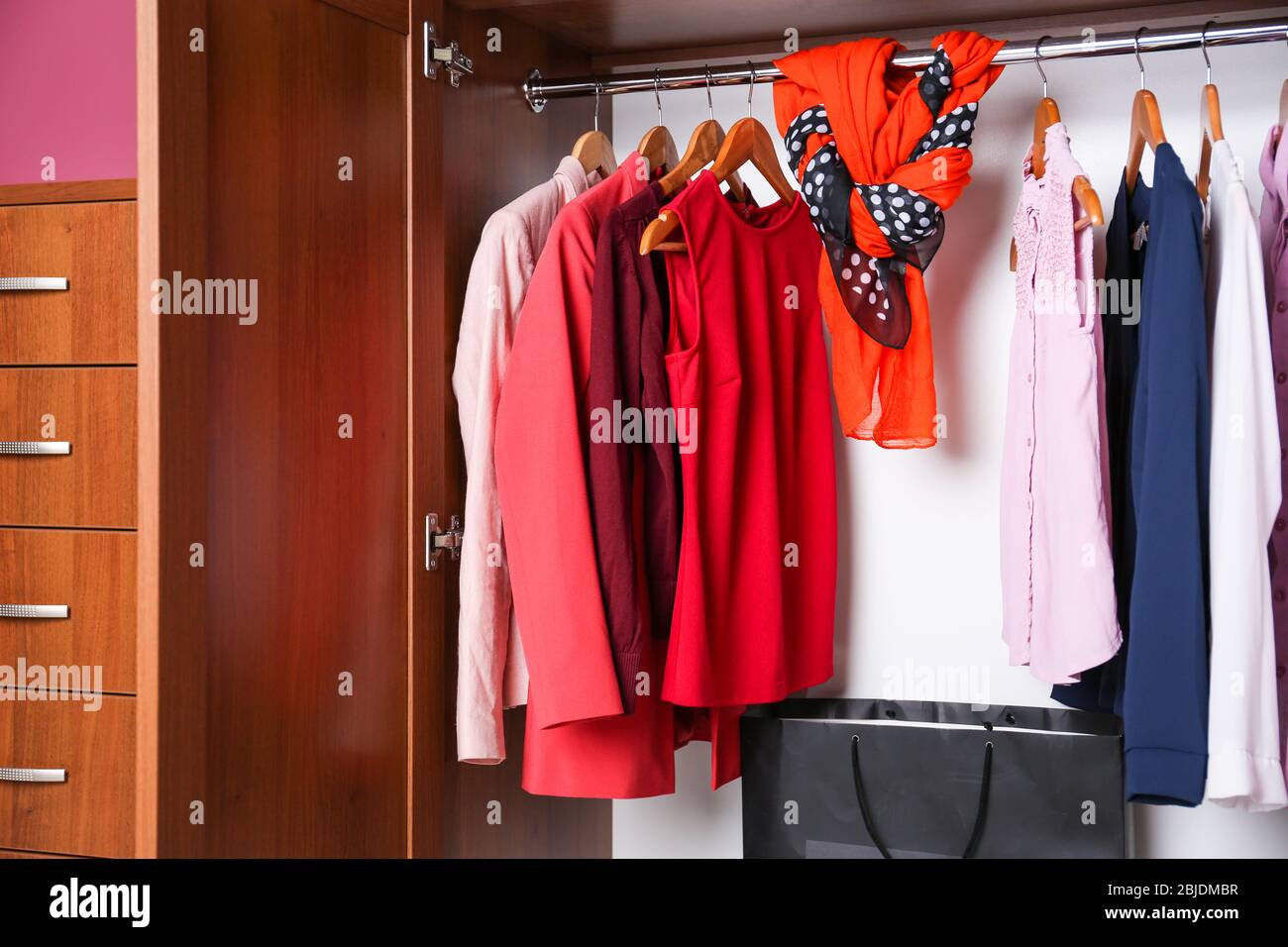 Elegant female clothes in wardrobe, closeup Stock Photo Alamy