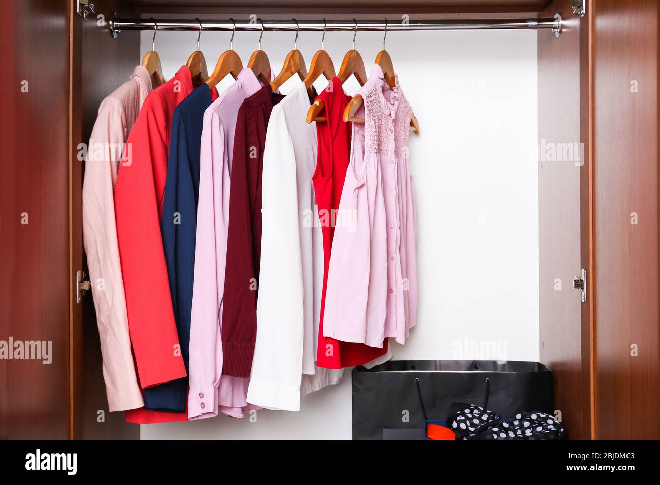 Elegant female clothes in wardrobe, closeup Stock Photo Alamy