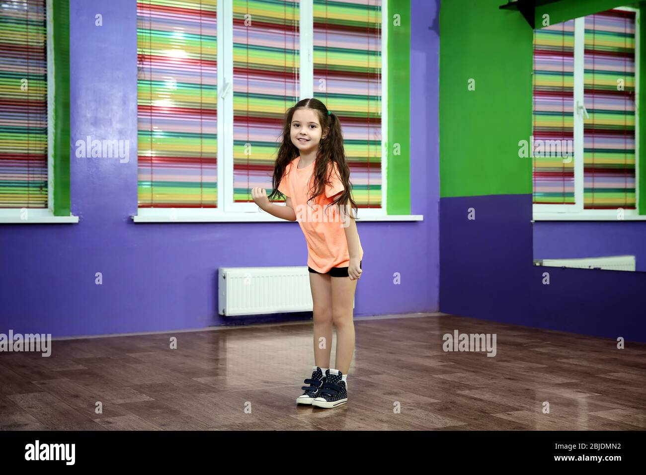Cute little girl dancing in choreography class Stock Photo Alamy