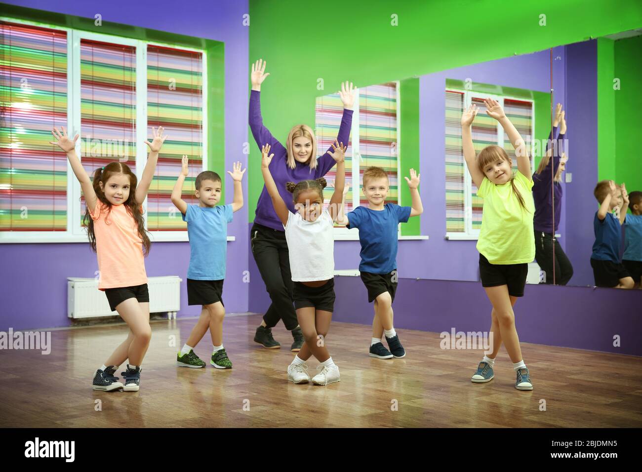 Dance teacher and children in choreography class Stock Photo Alamy