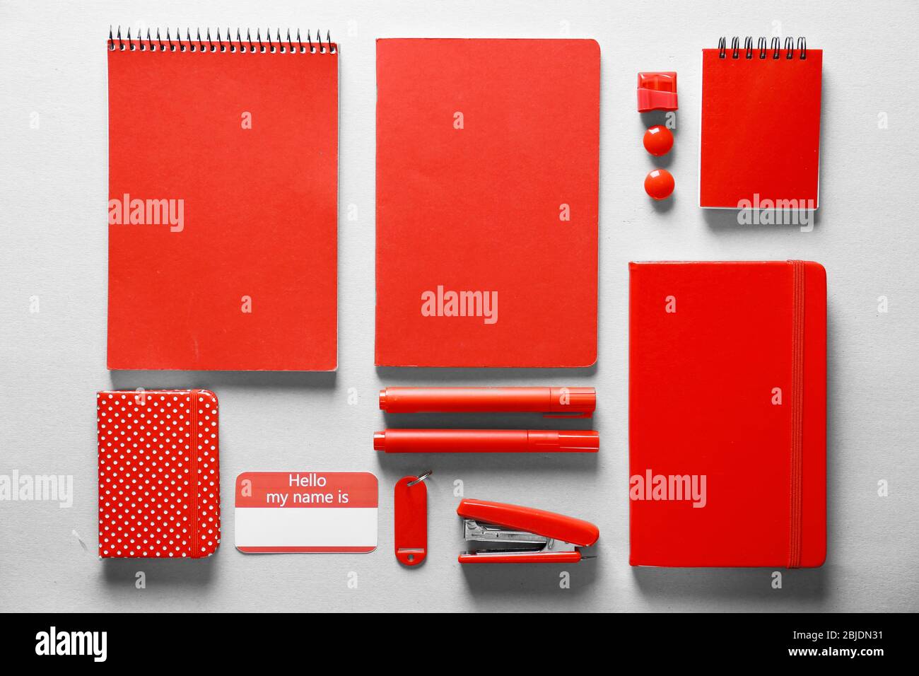 Red stationery set on light background Stock Photo Alamy