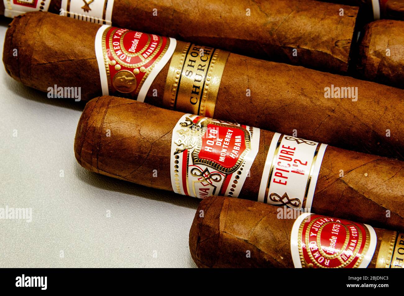 Cigars: Cuban Cigars. Romeo y Julieta and Hoyo de Monterrey. Hand rolled traditional tobacco product. White background. Stock Photo