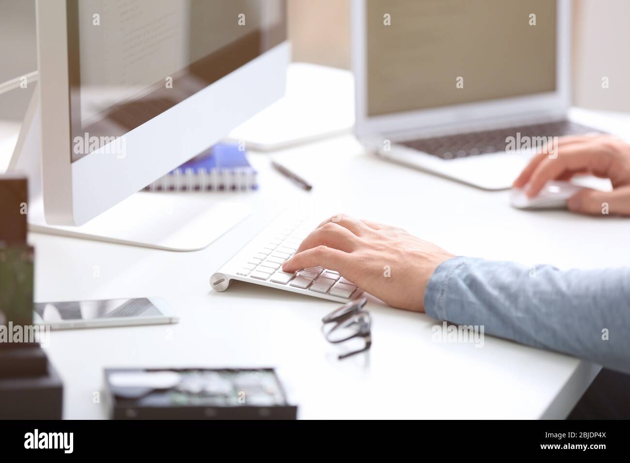 Hands of programmer working with computer in office Stock Photo