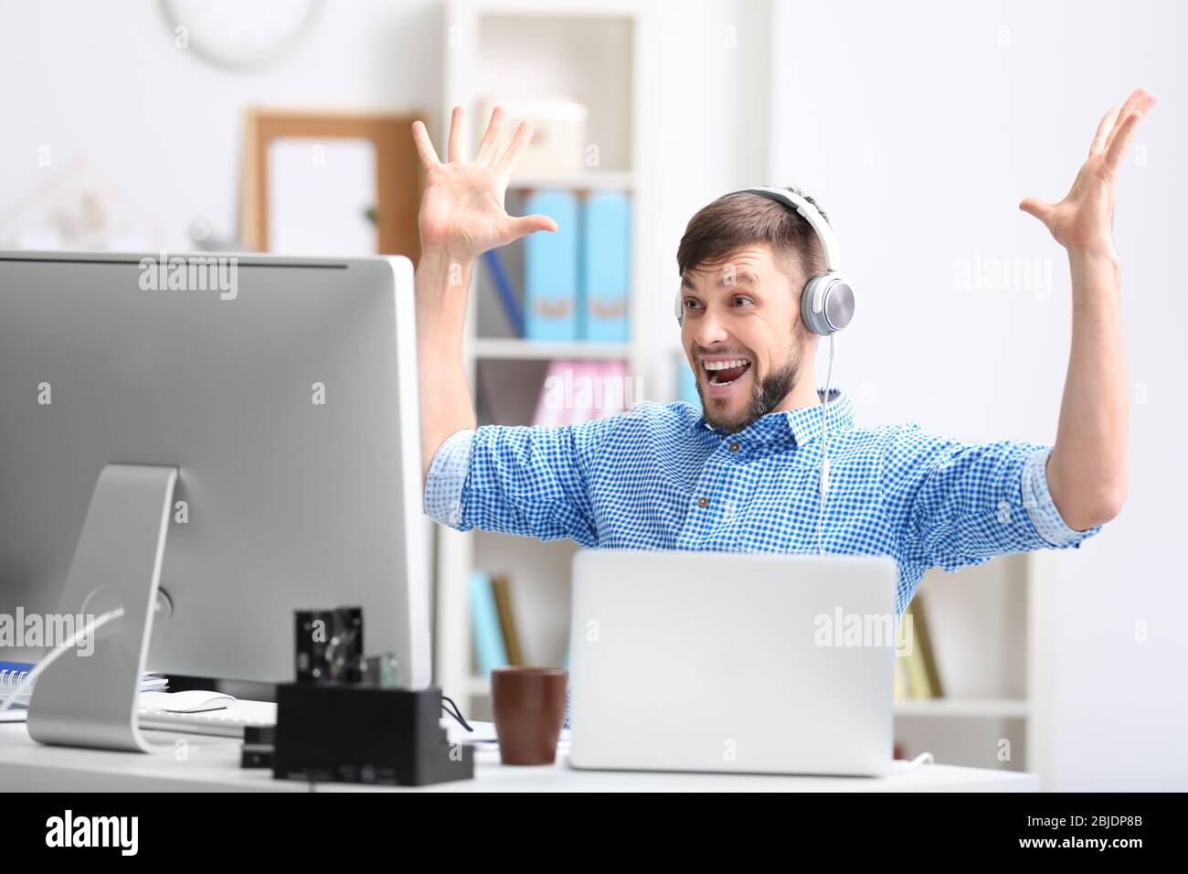 Handsome young programmer working in office Stock Photo