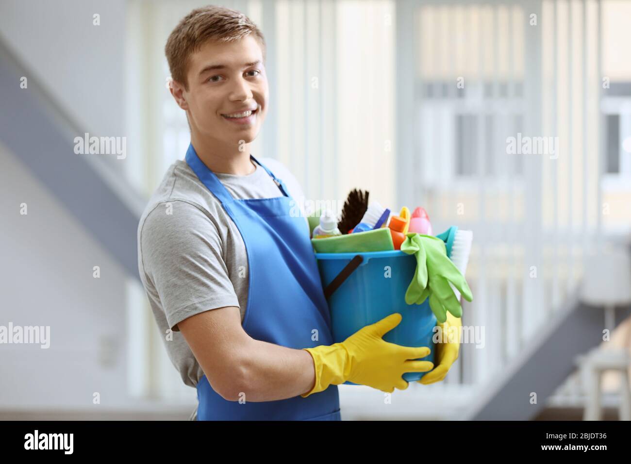 Man holding cleaning supplies hires stock photography and images Alamy