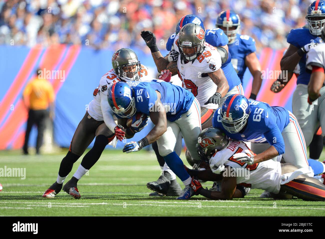 16 September 2012: New York Giants running back Andre Brown (35) is stopped by Tampa Bay Buccaneers linebacker Lavonte David (54) and Tampa Bay Buccan Stock Photo