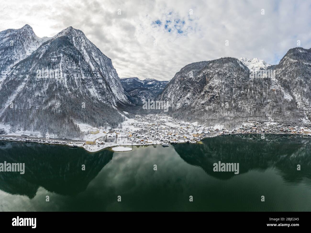 Aerial drone shot of Lahn village covered by snow by Hallstatt lake in  Austria during winter Stock Photo - Alamy