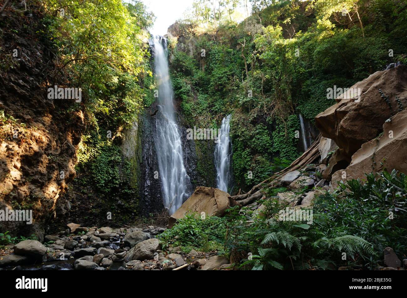 Waterfall is a beautiful place to visit with water coming from mountain ...