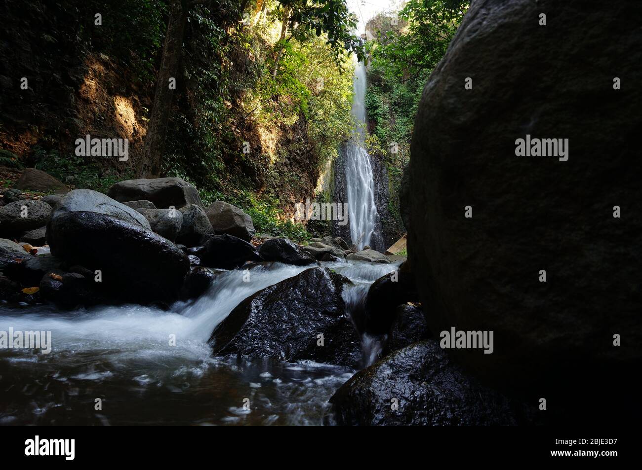 Waterfall is a beautiful place to visit with water coming from mountain ...