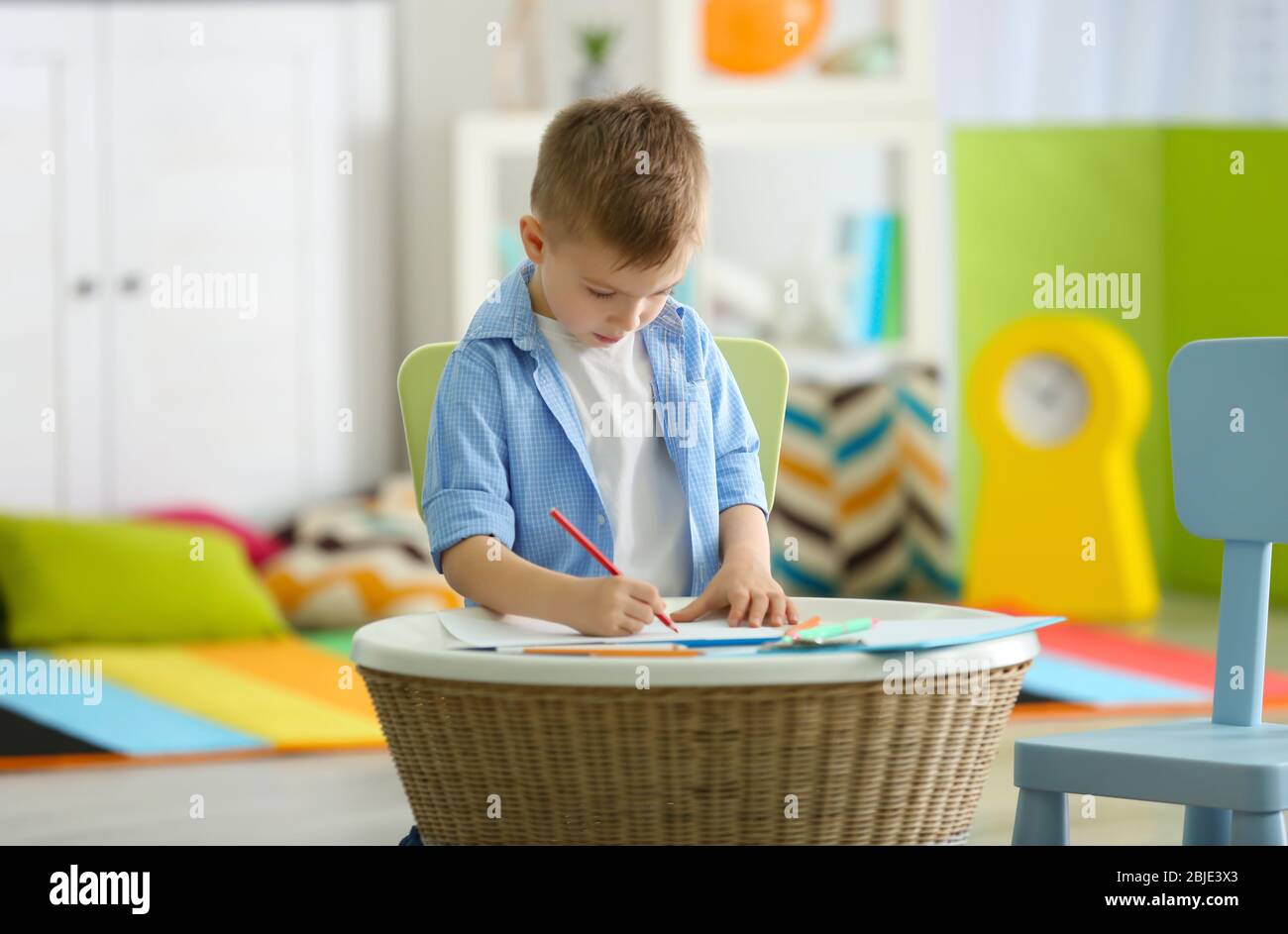 Little boy drawing picture at child psychologist's office Stock Photo