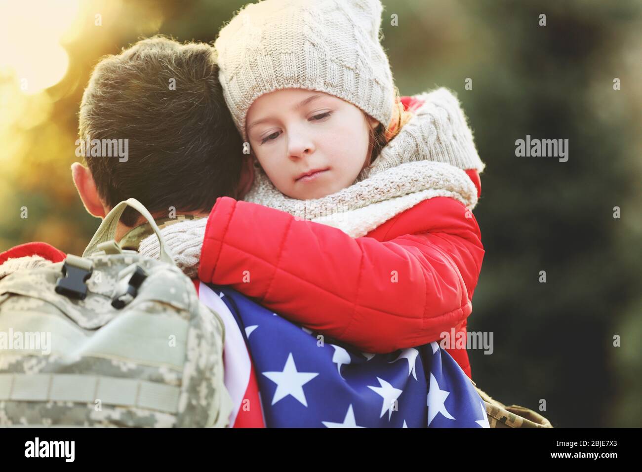 USA soldier hugging his daughter outdoors Stock Photo