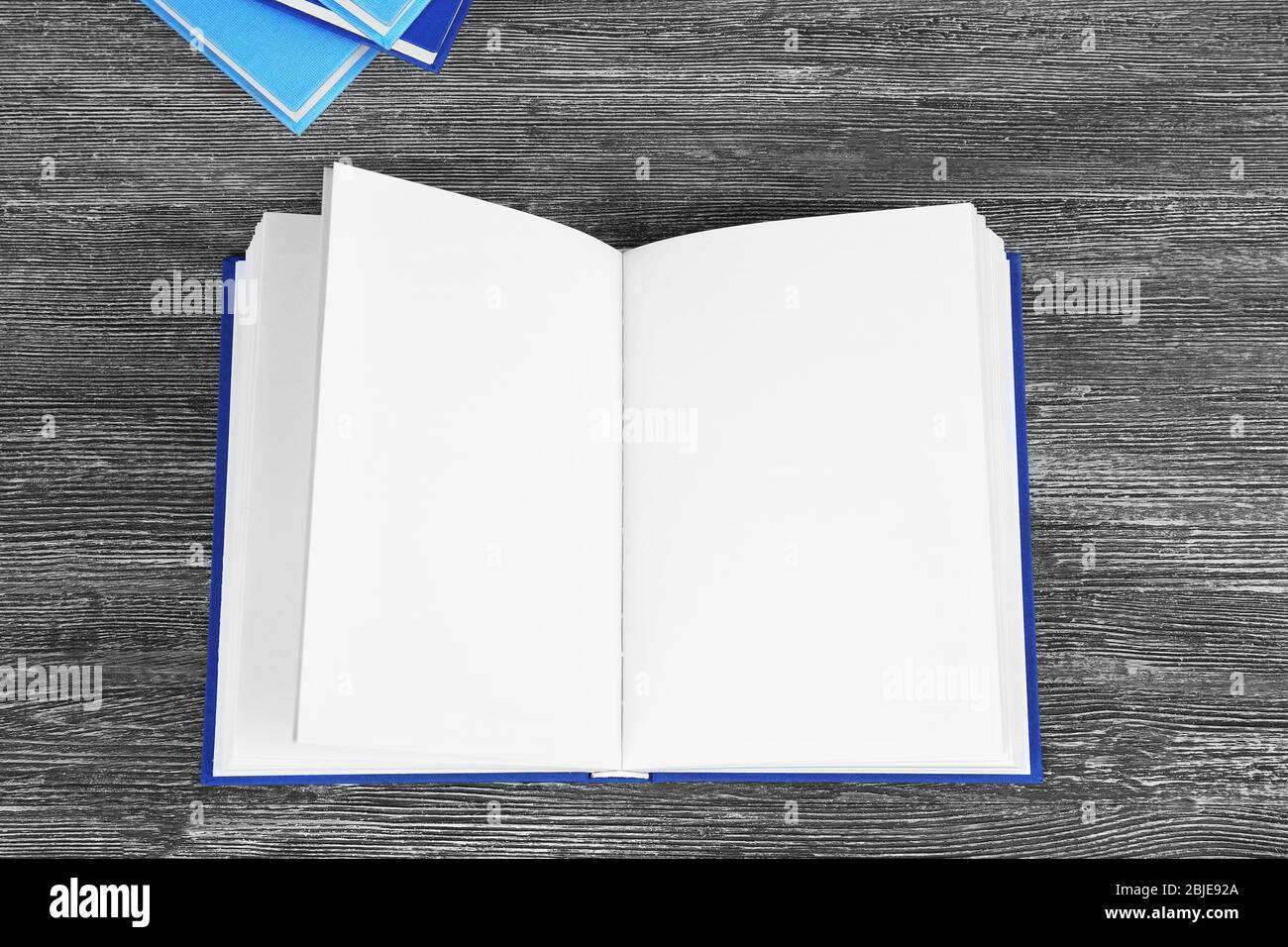 Opened book on grey wooden table Stock Photo