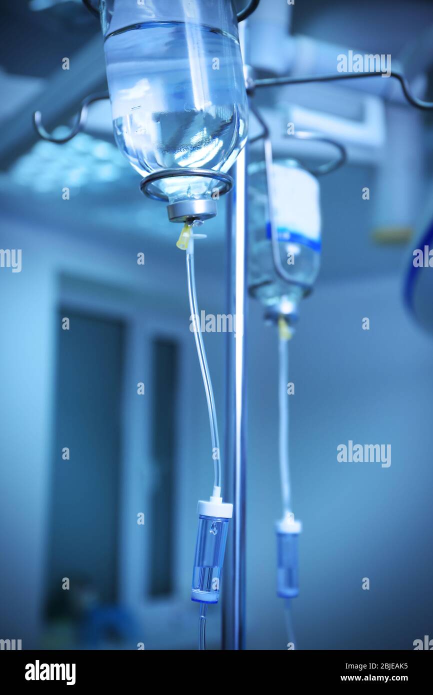 Infusion drip in hospital on blurred background Stock Photo - Alamy