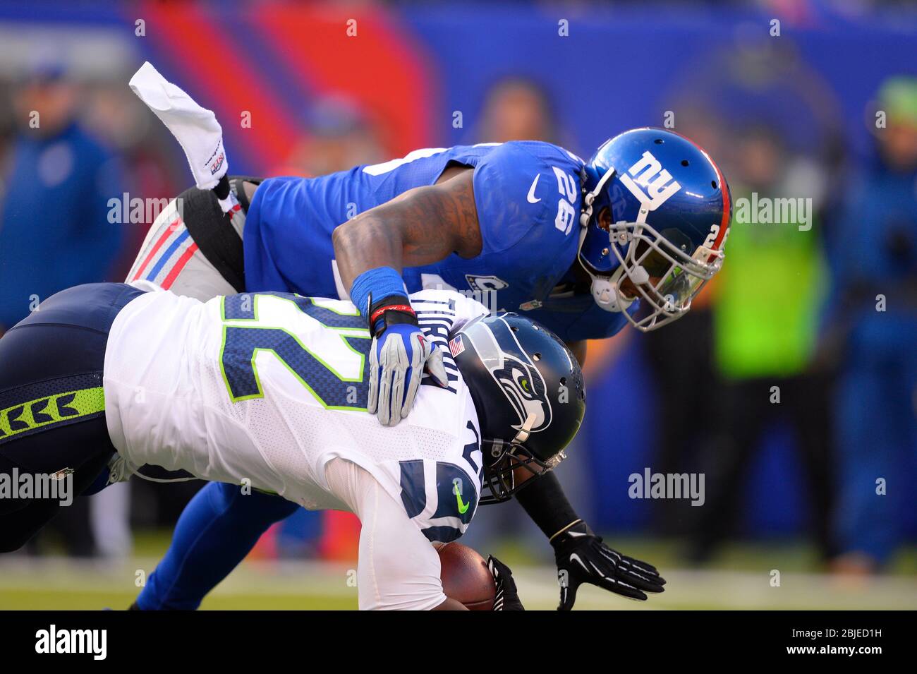 December 15, 2013: New York Giants strong safety Antrel Rolle (26) puts a hard hit on Seattle Seahawks running back Robert Turbin (22) during the firs Stock Photo