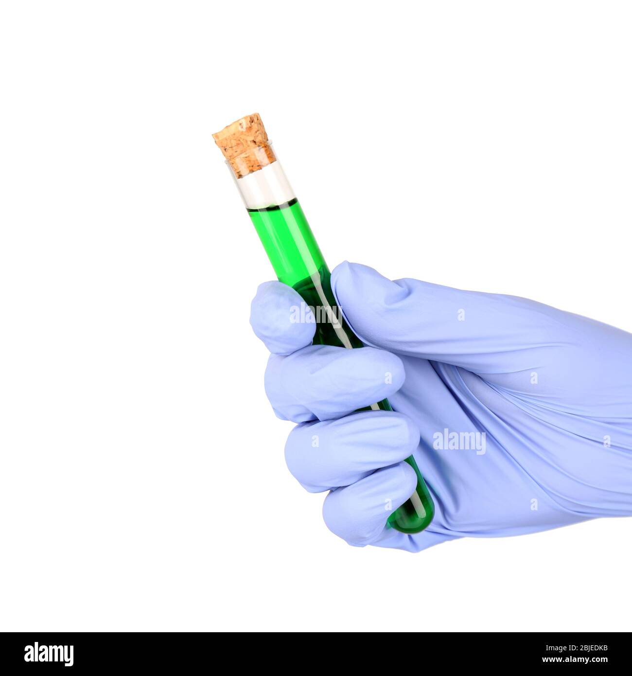 Hand in glove holding test tube with green sample on white background ...