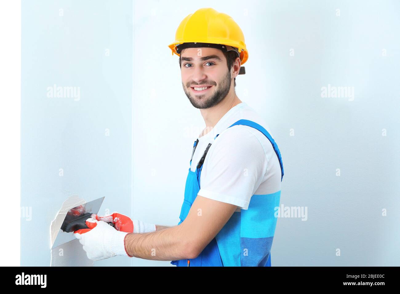 Shutterhand Worker Young worker making repair hi-res stock photography and images - Alamy