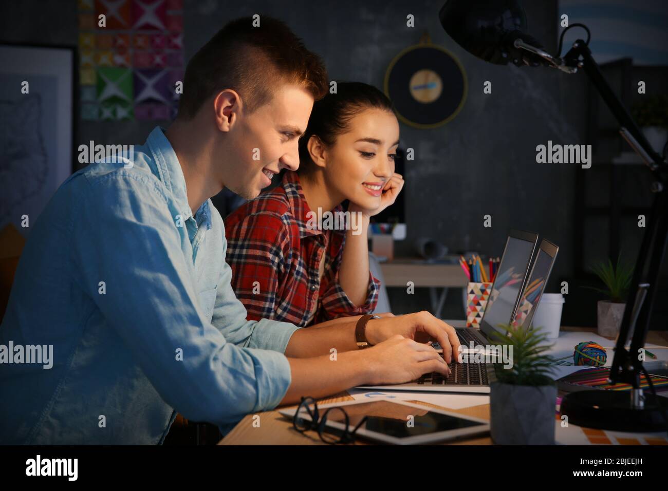 Two young designers at workplace Stock Photo