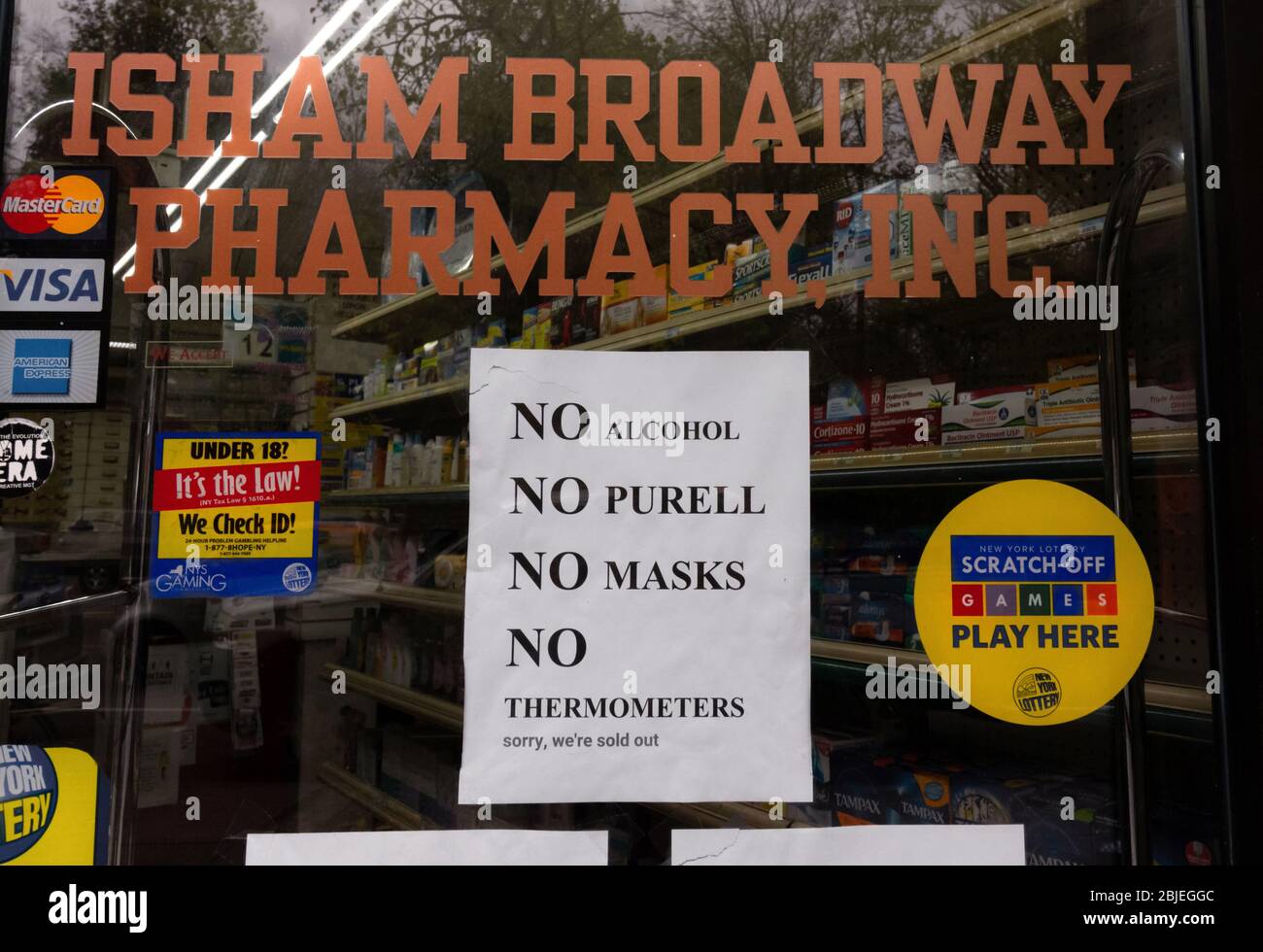 due to shortages in the coronavirus or covid-19 pandemic a pharmacy sign states it has no alcohol, no Purell, no masks, and no thermometers, Stock Photo