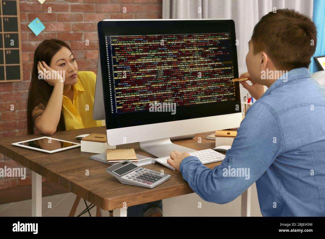 Young programmers working in office Stock Photo