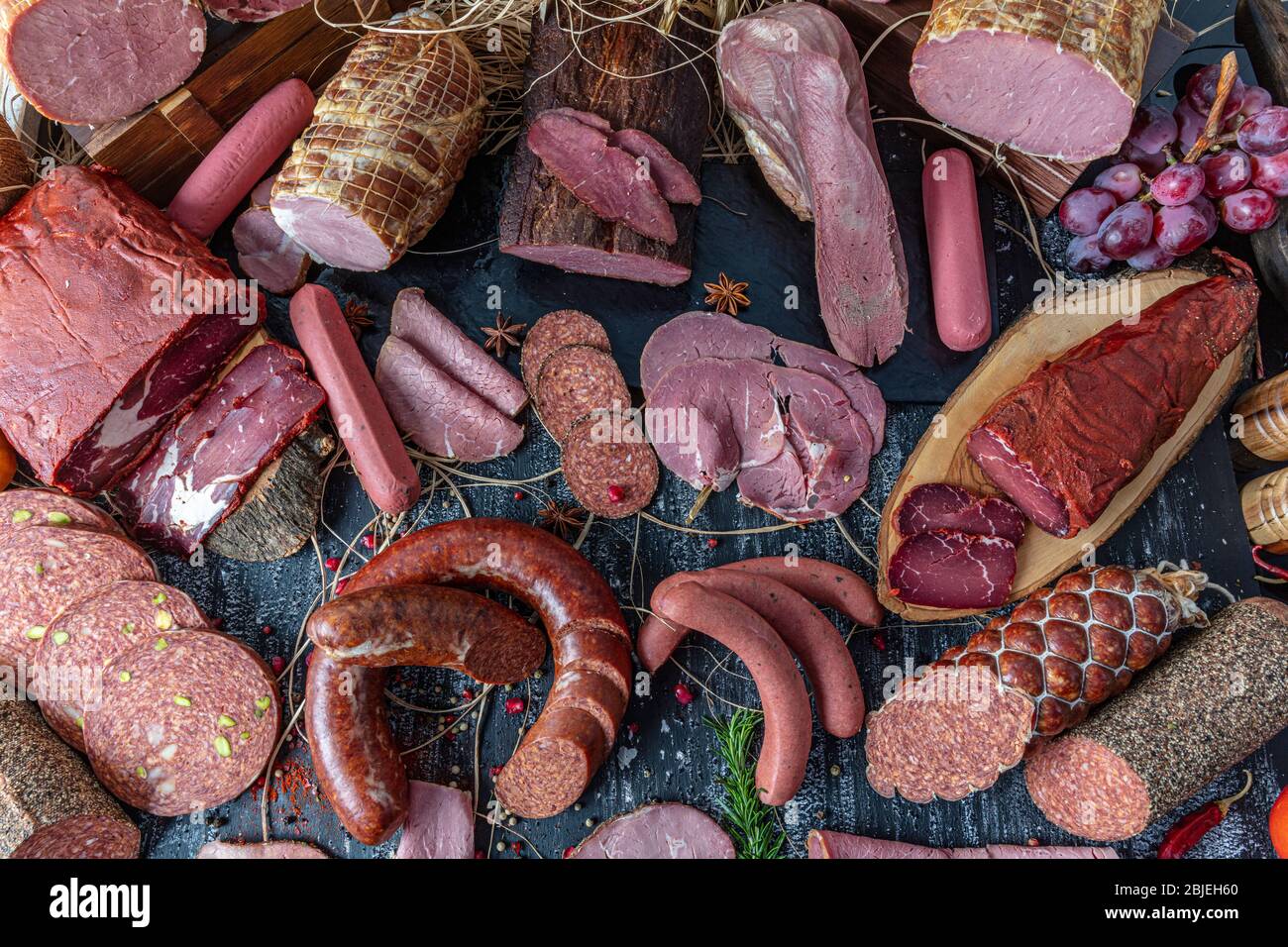 Smoked meat products. Display meats, cold cuts and sausages in a