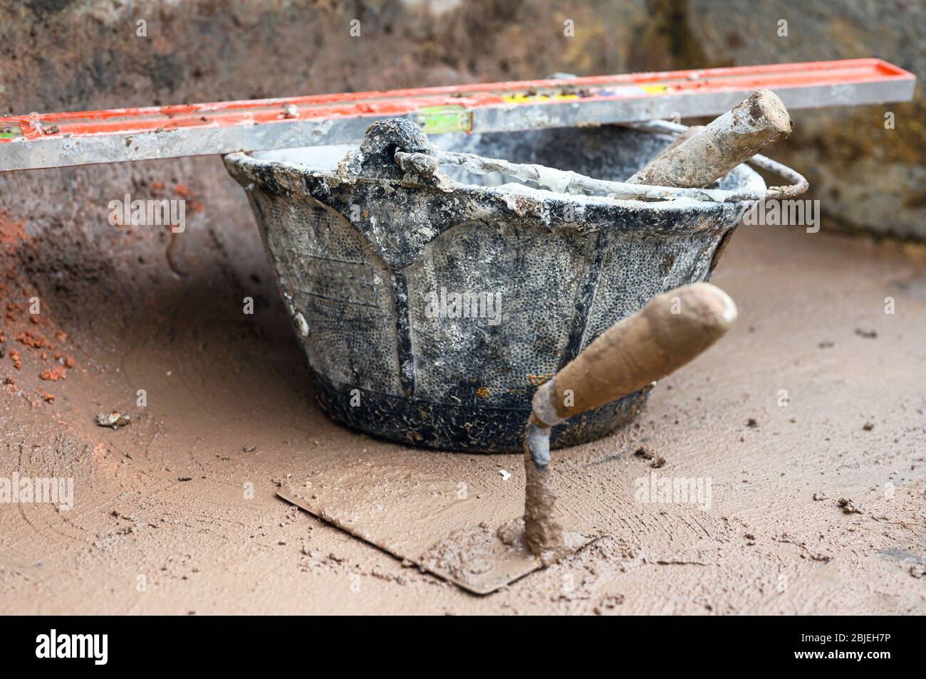 Construction tools background, bucket trowel and level . Stock Photo