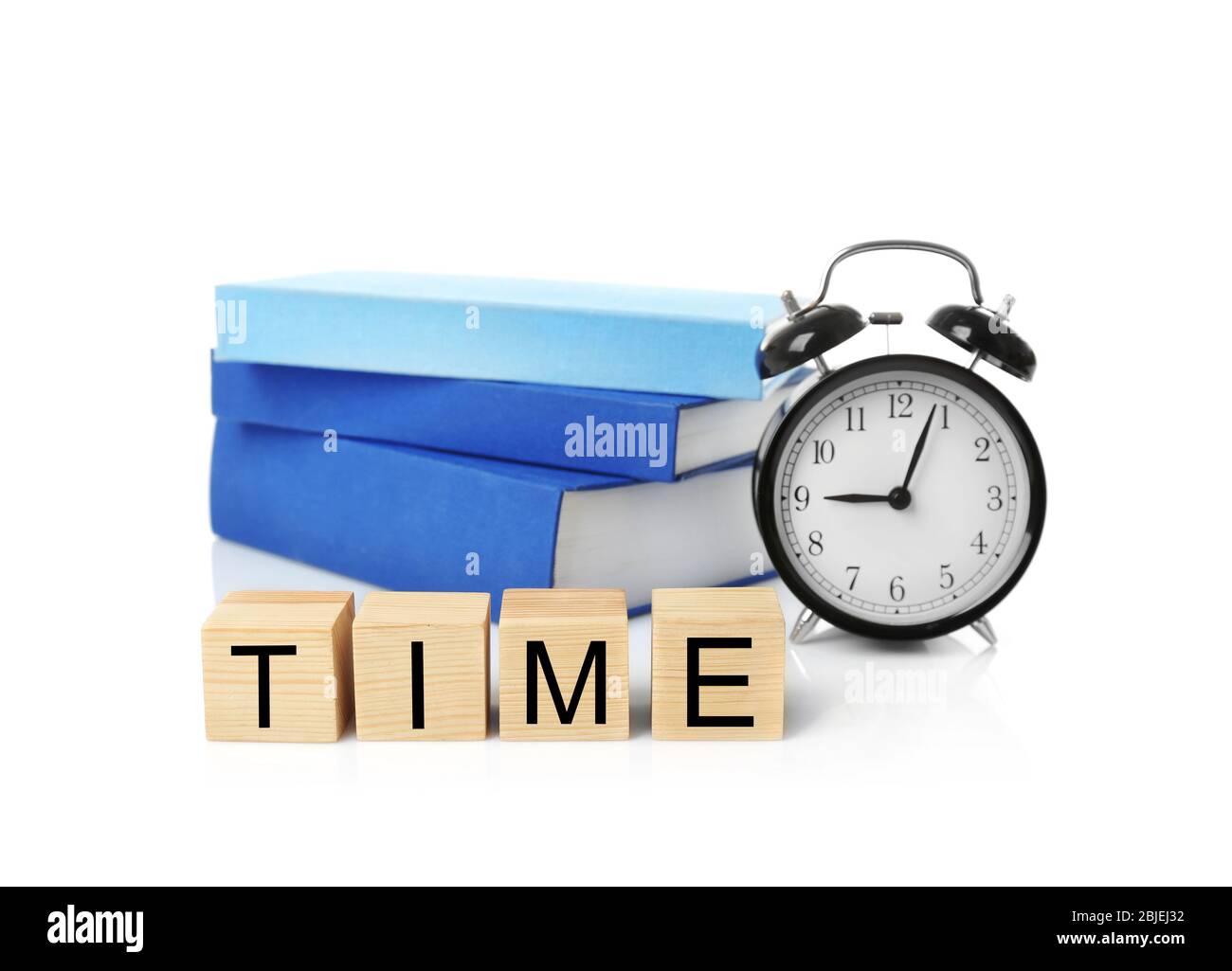 Cubes with alarm clock and stack of books on white background. Time ...