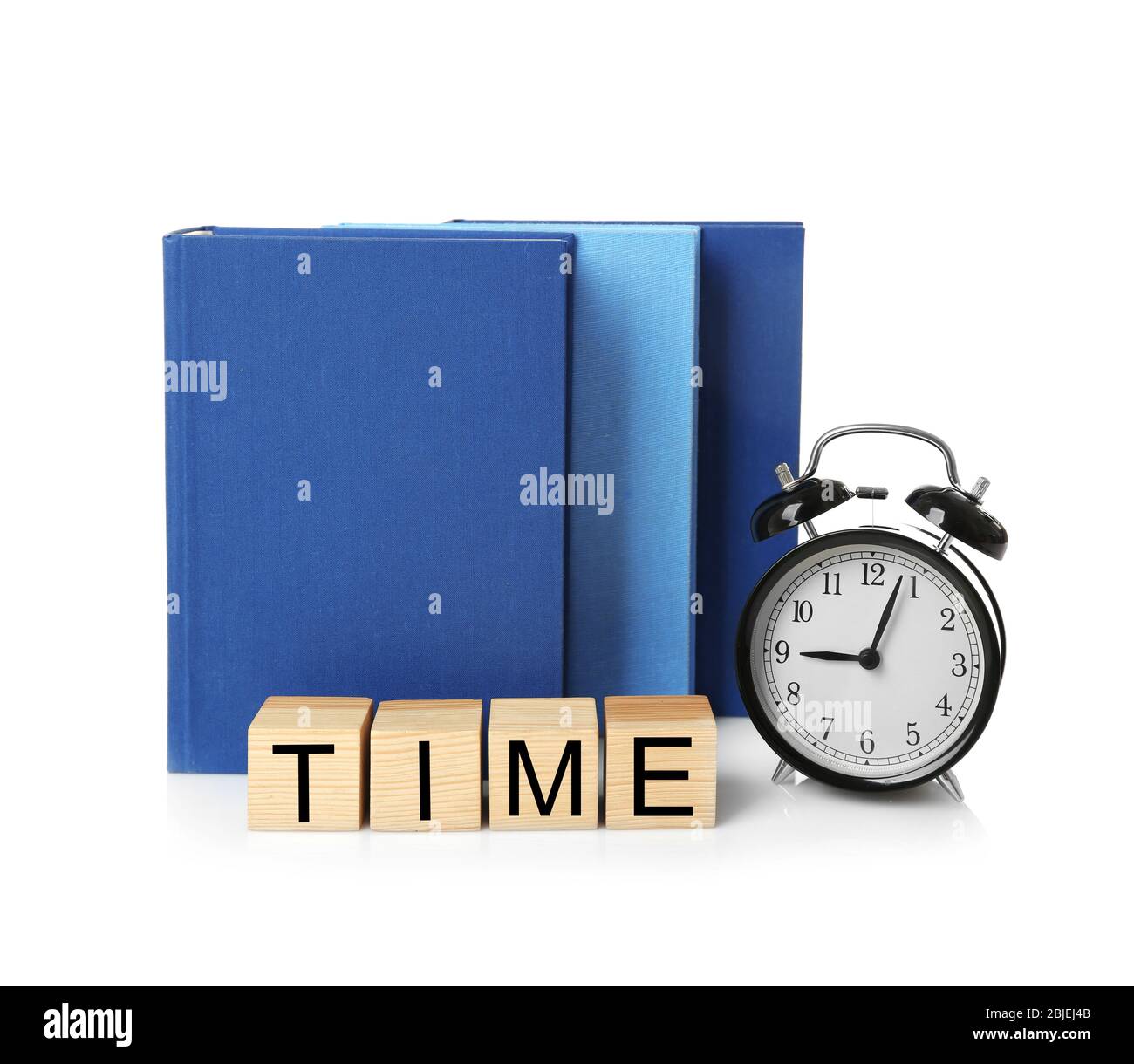 Cubes with alarm clock and books on white background. Time concept ...