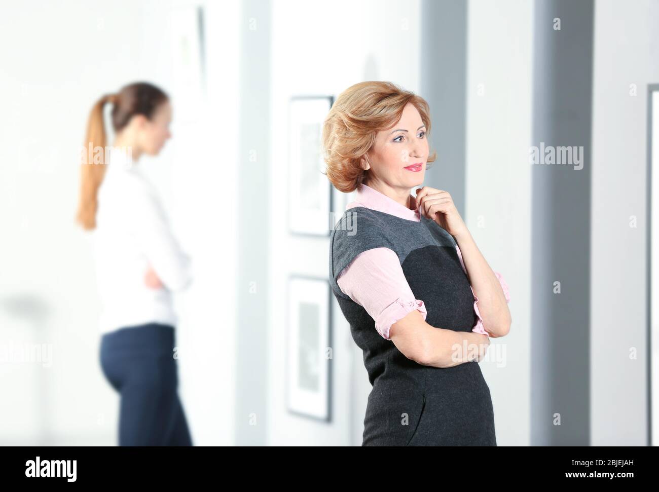 Beautiful women in modern art gallery Stock Photo - Alamy