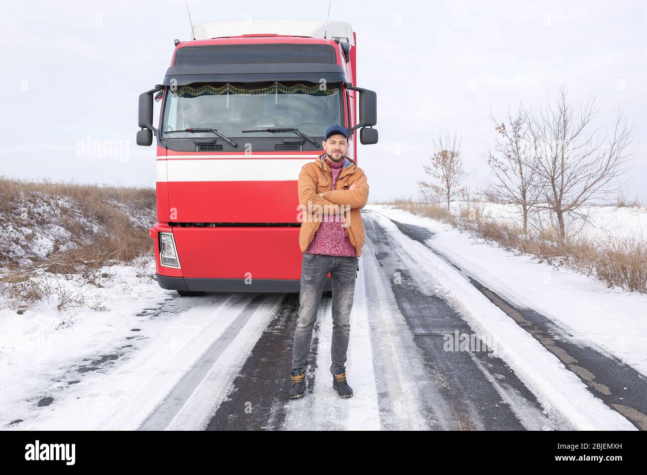 Handsome driver near big modern truck outdoors Stock Photo - Alamy